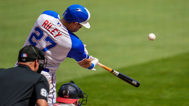 Jun 10, 2023; Cumberland, Georgia, USA; Atlanta Braves third baseman Austin Riley (27) hits a sacrifice fly ball to drive in a run against the Washington Nationals during the first inning at Truist Park. Mandatory Credit: Dale Zanine-USA TODAY Sports